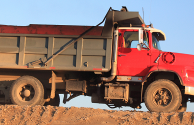 red dump truck on job site
