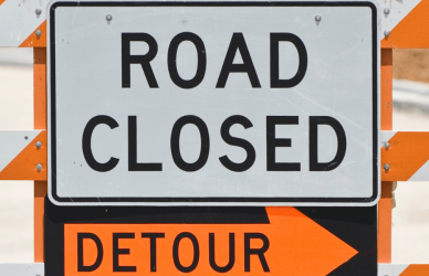 Detour road closed road sign