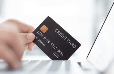 Online shopping with credit card and laptop