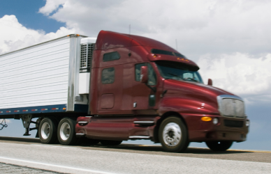 dark red semi truck on road