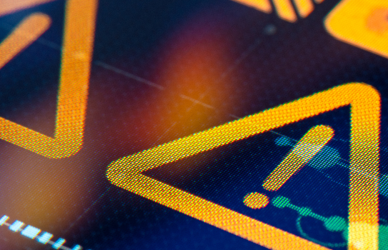 close up of an electronic device displaying an alert