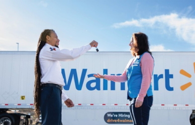Two people standing in front of a walmart truck. Walmart expands its innovative Associate-to-Driver program, offering associates a streamlined path to earn a CDL and join Walmart’s Private Fleet.