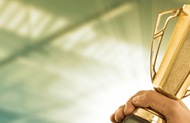 hands holding trophy