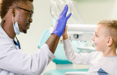 doctor high fiving child patient