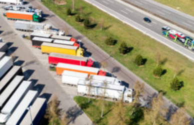 Semi trucks parked at roadside rest area