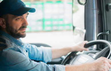 truck driver behind the wheel of semi truck