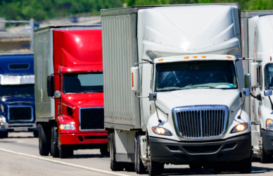 variety of semi trucks on interstate highway, trucker overtime pay