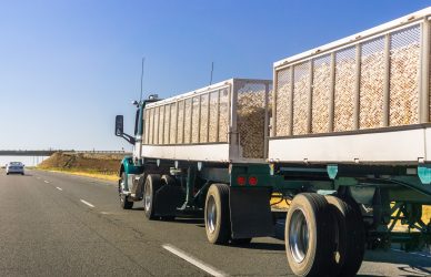 Truck delivering harvested onion on the interstate, California