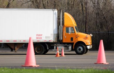 Student truck driver practices parking maneuvers