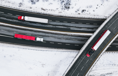 Trucks driving in winter weather. Prepare for winter roads with expert tips from seasoned truck drivers.